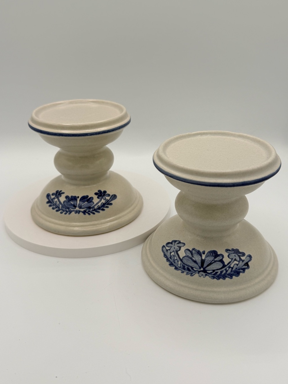 Vintage Pfaltzgraff Yorktowne stoneware candle holders with blue floral motif.